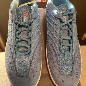 Nike Light Blue Low-Top Skate Shoes with Orange Lace Tip